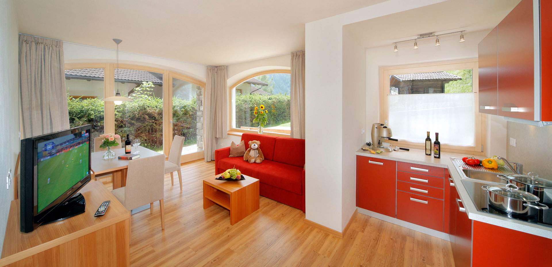 Living area with kitchenette and door to the garden